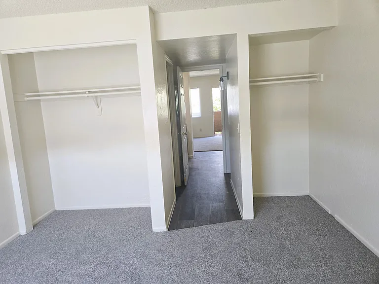 Full sized closet and smaller closet