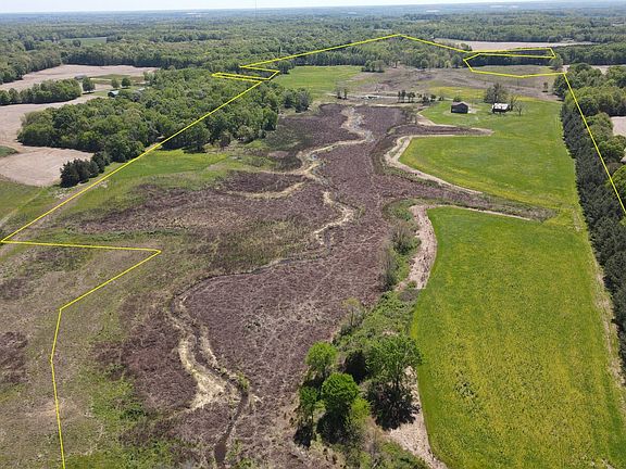 Looking south across the property. The non green areas is the conservation easement. A large pond used to exist in this area. Now the area has been restored and replanted with native plants and trees at the rate of 1,000 stems per acre.