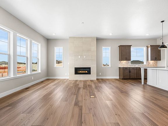 Spacious gathering room with interior fireplace