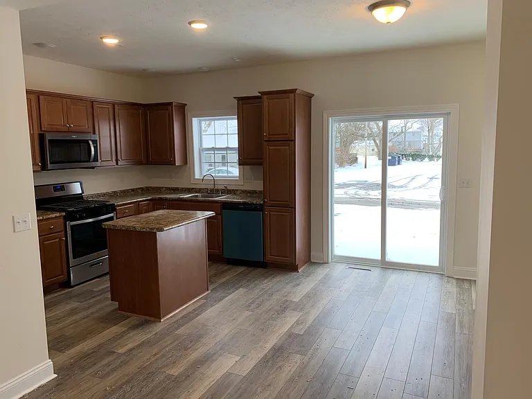 Kitchen with Dining Rm and Outside Patio
