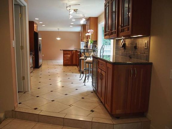 This area of the kitchen has its own beverage refrigerator and is so convenient to both the patio and family room!