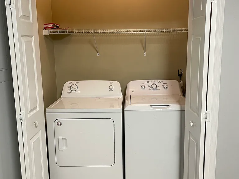 The laundry closet is conveniently located in the kitchen. The full-sized washer and dryer are included.