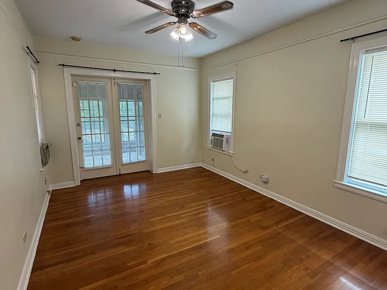 bedroom with enclosed porch and laundry
