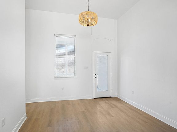 living room with glass door to outdoor screened in porch