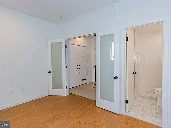 First floor: Bedroom with full bathroom