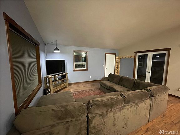 Living room has nice great looking glass French doors leading to a convenient Den/Office space. 