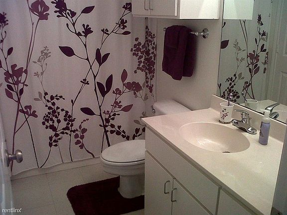 Bathroom includes ample storage.