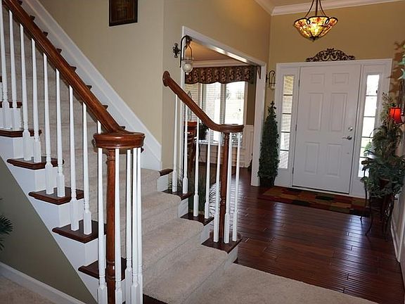 The  covered front porch leads you to the entry that boasts 10' Ceilings with crown molding and beautiful wood floors.   The open floor plan allows you to view the stunning home as soon as you enter the door!