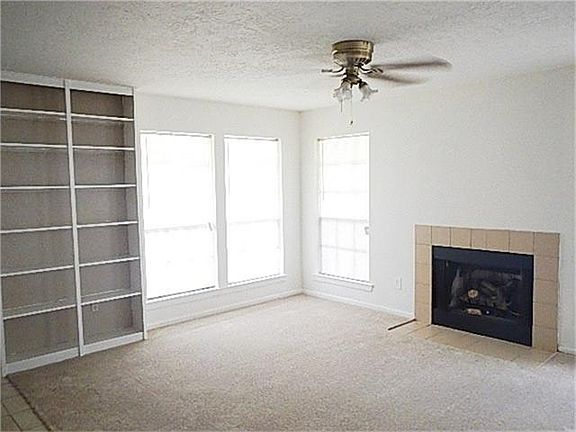 WINDOWS IN LIVING AREA PROVIDE NATURAL LIGHT THROUGHOUT