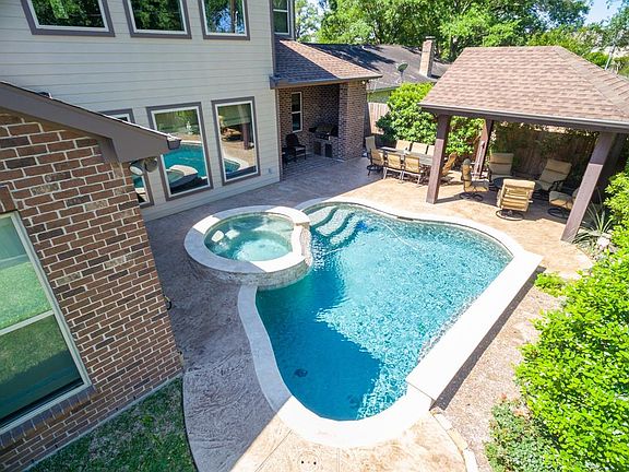 This wonderful 4/5 bedroom custom home offers an inviting backyard retreat!