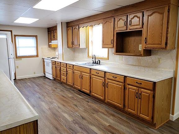 Huge kitchen with tons of cabinets. Includes a microwave shelf.