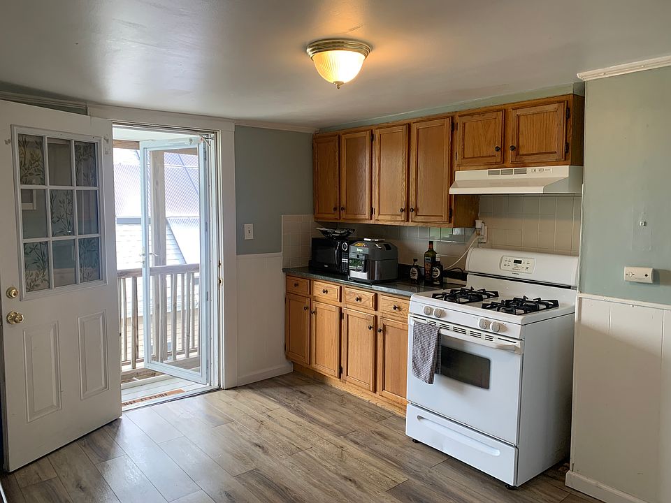 Eat in Kitchen with door to porch. Screen door attached to let in a breeze.