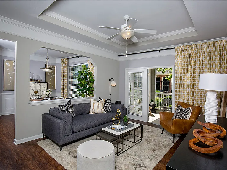 Living room with crown molding and tray ceiling