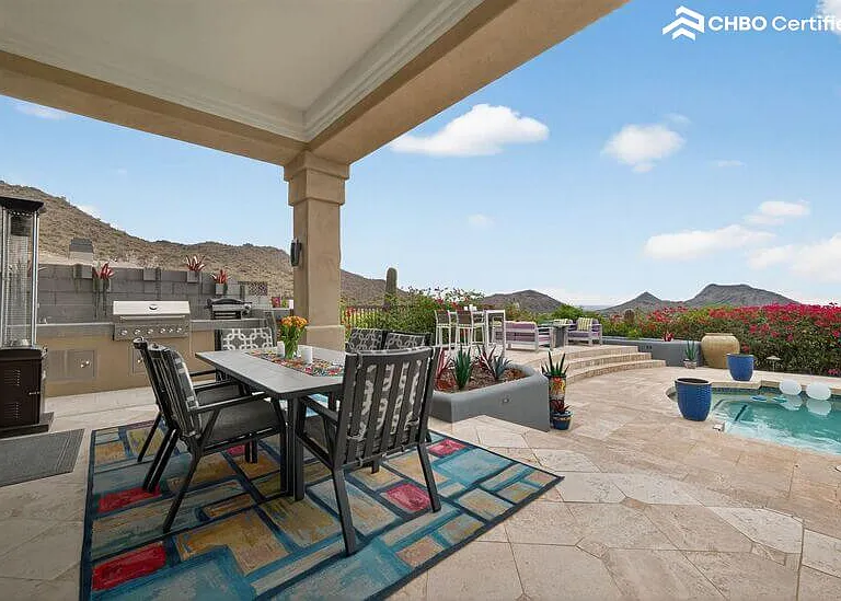 Covered dining by outdoor kitchen