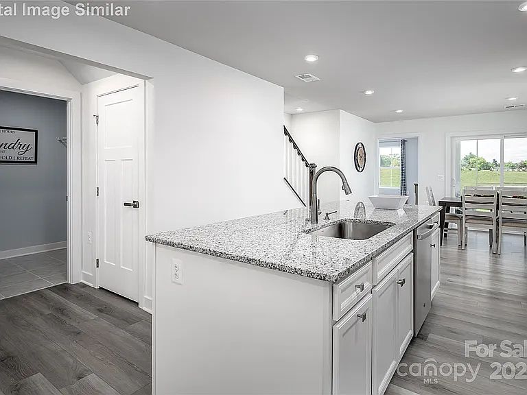 Photos are of the model home: The same floor plan and similar finishes as 107 Jameson Park Dr. #5