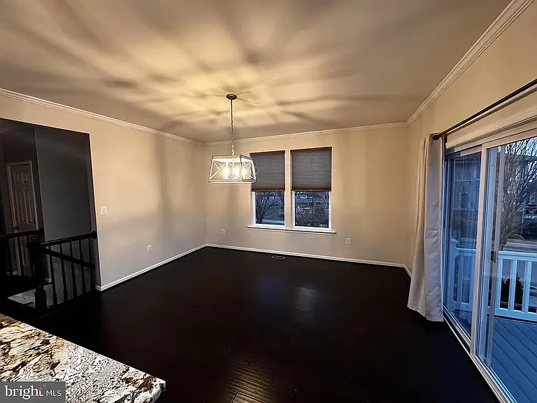 Open dining area leading to back deck