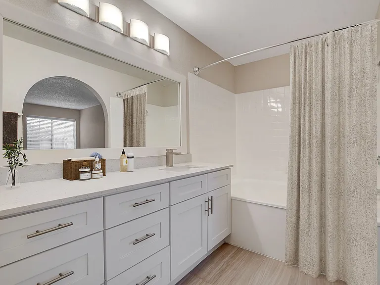 Welcome to Invitational, where modern elegance meets comfort in every detail. This stunning bathroom features sleek cabinetry, stylish lighting, and a serene ambiance. Elevate your living space todayschedule a tour and see it for yourself!