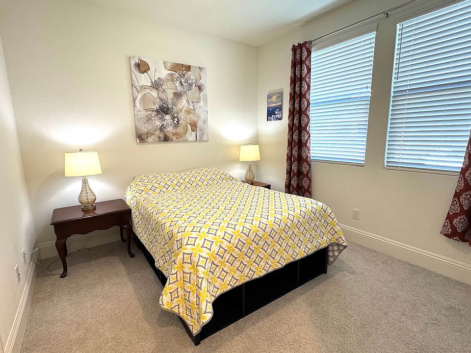furnished bedroom has a form matress full size bed.