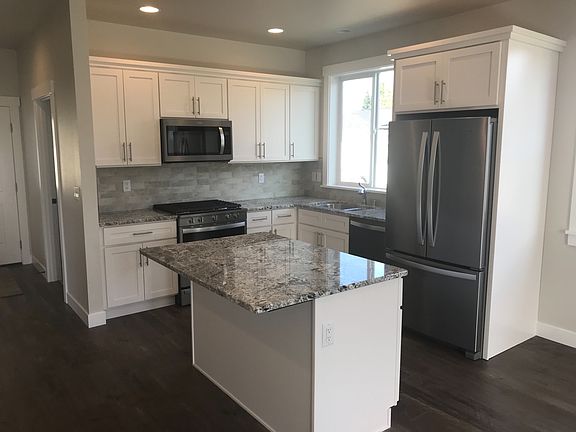 Kitchen with granite and stainless appliances