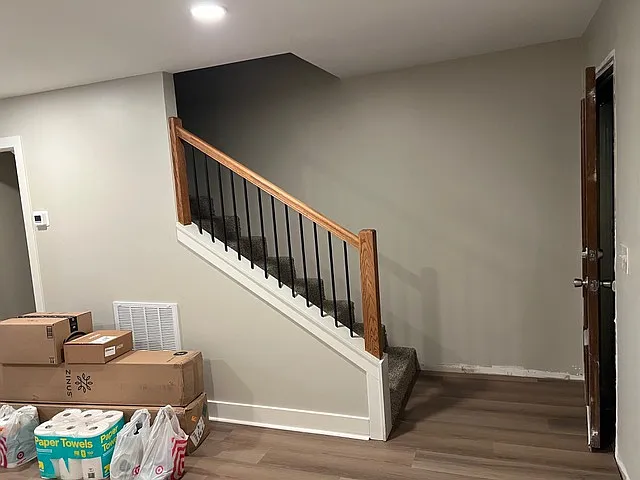 Stairs to second floor. Front door has been replaced since this photo was taken.