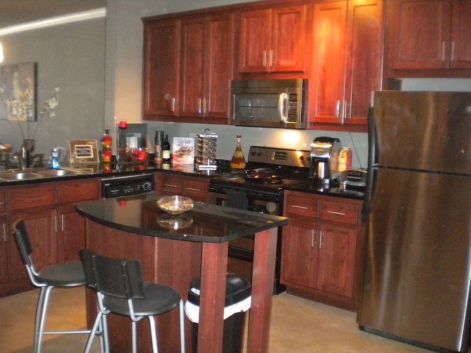 Stainless Steel Appliances and Black Granite Countertops