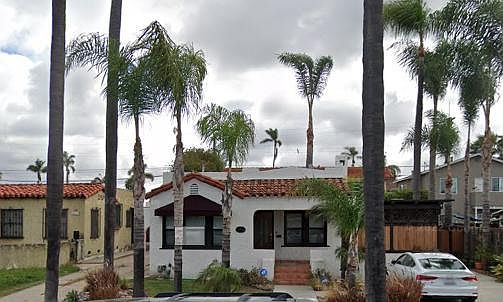 House in front of condo units. Enter on the right of house.