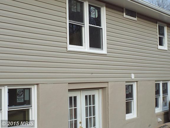 Rear is vinyl with walkout basement