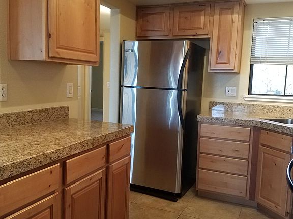 Kitchen with granite counter tops.