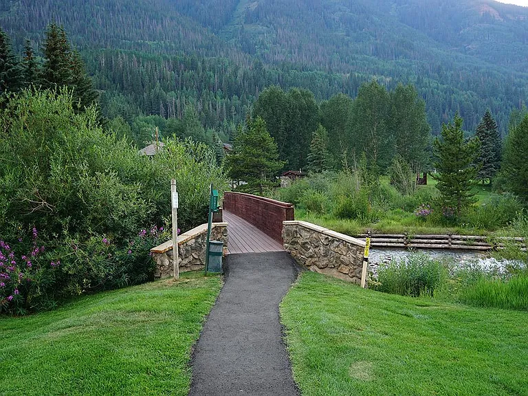Bridge over Gore Creek leading to the park, cleared and maintained year round.