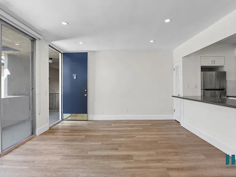 Front Entrance and Open-Concept Kitchen, Dining, and Living Room Areas