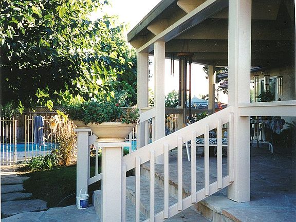 Back porch, pool beyond