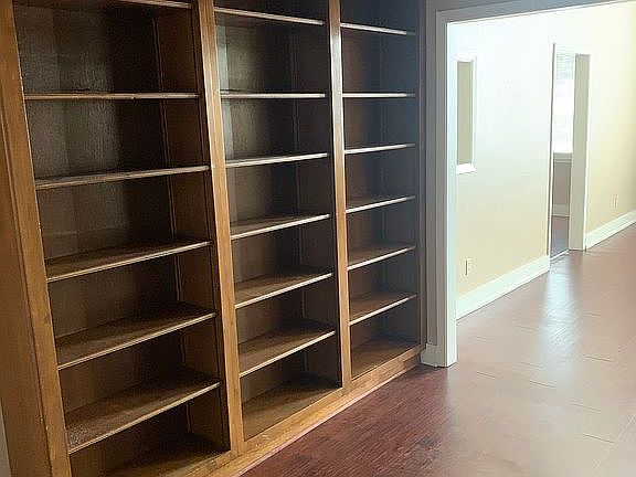 Recessed bookcase in library