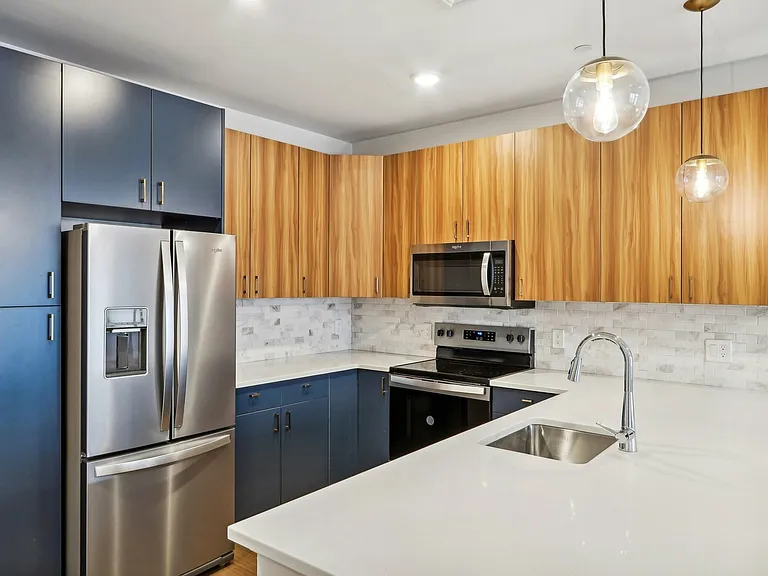 The Willow Floor Plan Corner Kitchen with Stainless Steel Appliances