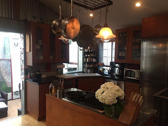 Kitchen w/extra deep sink, granite cooking island, indoor ga