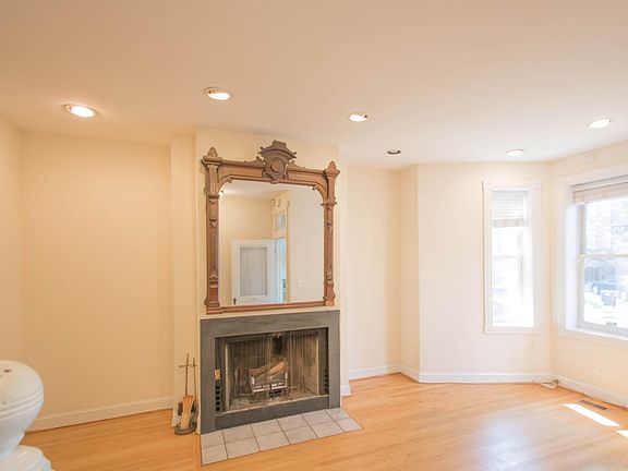 LR with fireplace & decorative mirror
