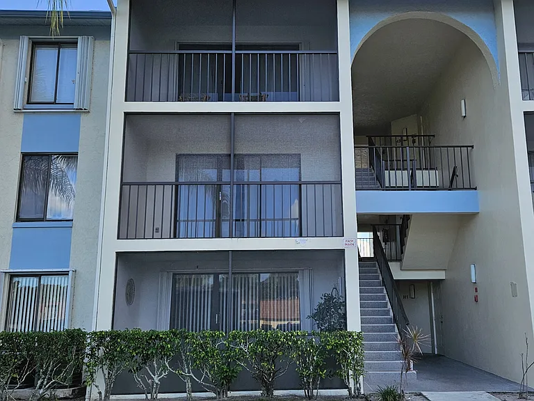 Front view - 3rd floor Unit with Accordion Hurricane Shutters