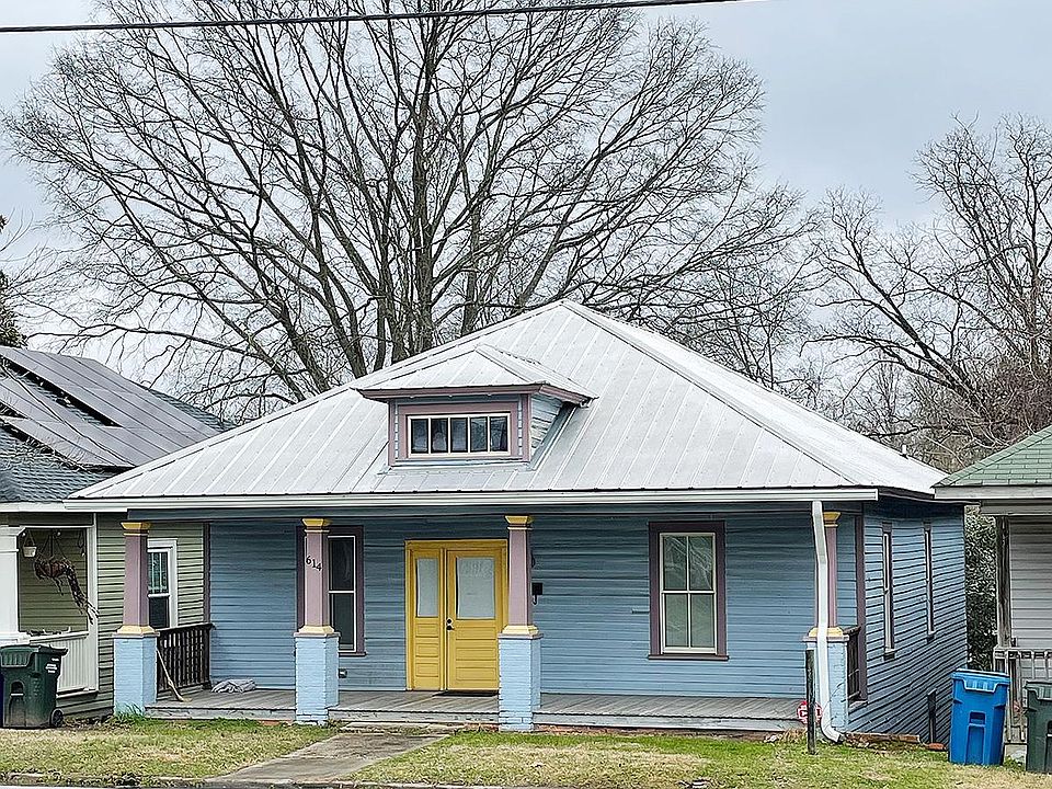 "The middle house" of the Queen Street triplets, nestled just at the edge of downtown