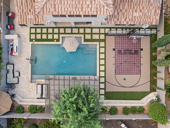 Backyard areal. Large Ramada at the back of the pool.