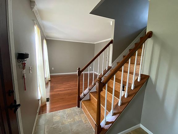 Stairs to second floor and living room