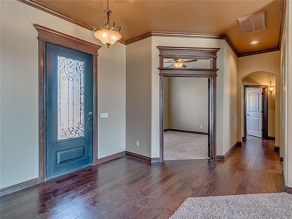 Large entry with beautiful hard wood floors. Heavy oversized door. Study is large, as well.
