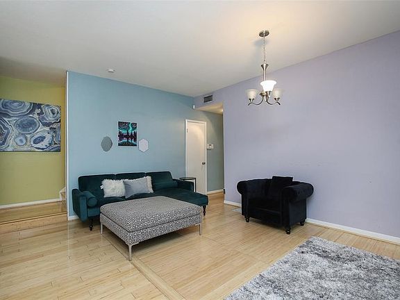 Bamboo flooring extends throughout the living & dining areas.