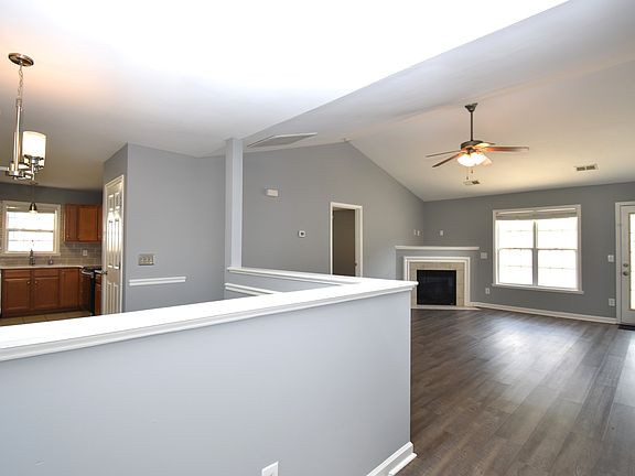As you enter the home you are greeted by the large living room, dinning area and kitchen.