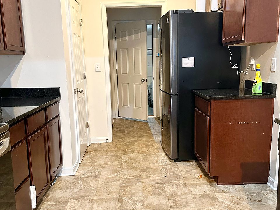 Kitchen area and path to Attached Garage