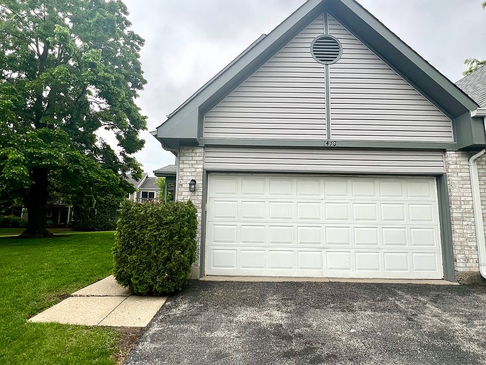 Front of home with 2-car garage and 2-car driveway