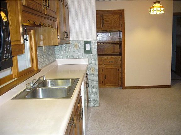 Another view of the kitchen with the built-ins in the back, lots of extra storage.