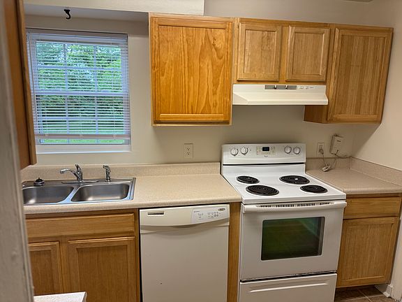 Kitchen with full-size dishwasher, stove, fridge