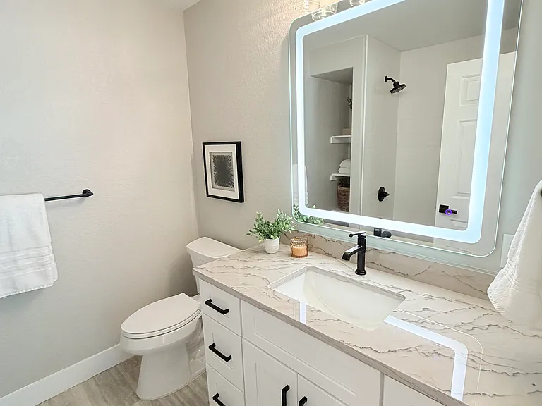 Downstairs bathroom, LED lit mirror and bathtub-shower