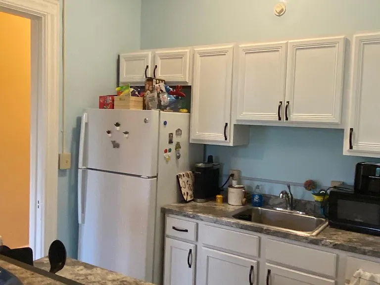 Kitchen from barstool chair by breakfast bar