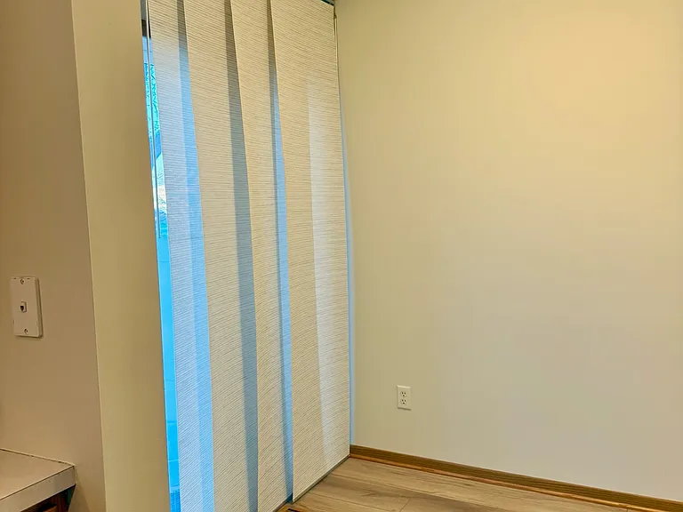 Informal dining area next to sliding door to patio