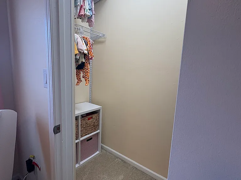 Second bedroom walk in closet with adjustable shelving system